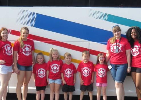 Campers and Counselors in front of bus