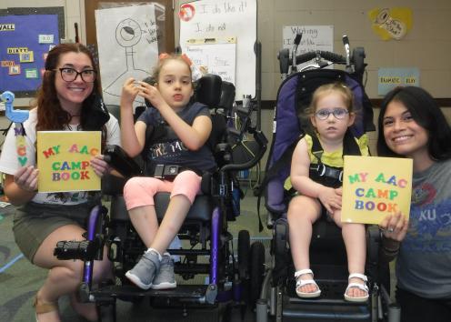Children with AAC devices at camp